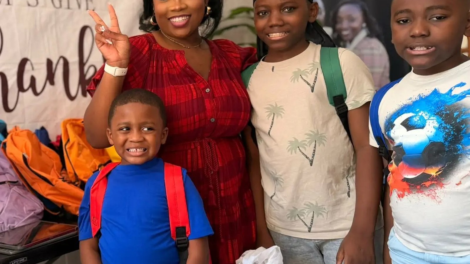 Children and young people smiling at a church community event.